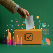 A conceptual image of a ballot box in orange with a checkmark icon on the front. A hand is placing a ballot into the box, while data visualizations like charts and graphs emerge around it against a green background. The image conveys themes of data transparency and informed decision-making
